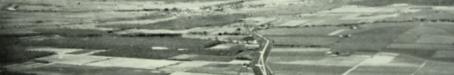 Aerial view of Gordonvale and surrounding cane farms, 1954